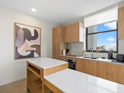 a kitchen with white countertops and a large window at Central Downtown Condo - Rooftop Pool Access in Miami