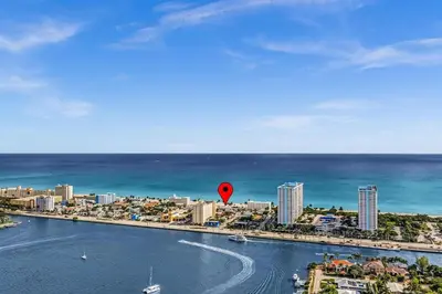 a red balloon in the water next to a city at Santorini Blu Boutique Beach Studio Steps to Ocean in Hollywood