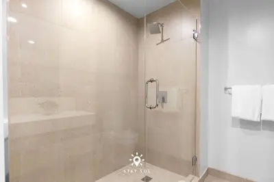 a bathroom with a shower with a glass door at 1BR Apartment New Luxury in Miami