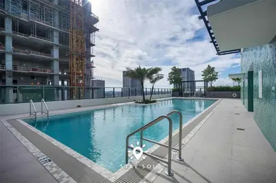 a large swimming pool on top of a building at Stylish Miami Studio Perfect for City Living in Miami