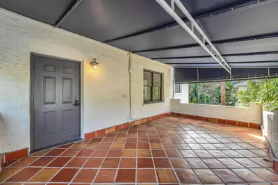 an empty room with a door and a tile floor at Victoria Park Oasis Walk to las Olas Beach in Fort Lauderdale