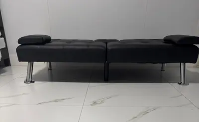 a black dog bed sitting on a white floor at Beautiful 1 bedroom Studio located in Miramar in Miramar
