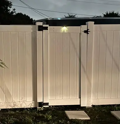 a white fence with a light on top of it at Beautiful 1 bedroom Studio located in Miramar in Miramar