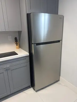 a stainless steel refrigerator in a kitchen at Beautiful 1 bedroom Studio located in Miramar in Miramar