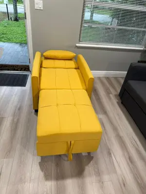 a yellow couch sitting in a living room at Hollywood Escape in Hollywood