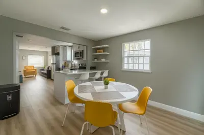 a kitchen and dining room with a table and chairs at Hollywood Escape in Hollywood