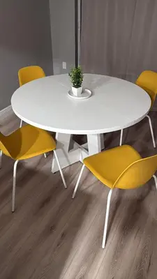 a white table and chairs with a white table and yellow chairs at Hollywood Escape in Hollywood