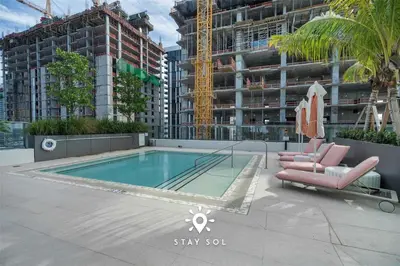 a swimming pool on the roof of a building at Sophisticated Studio with Pools in Miami