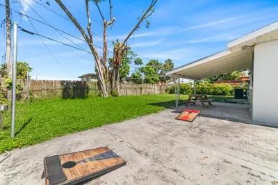 a backyard with a picnic table and a fence at Casa Sol - 4 Bedroom 2 Bath - 7 beds - Affordable Stays For Large Groups in Ives Estates