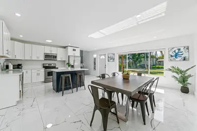 a kitchen with a table and chairs in it at Casa Sol - 4 Bedroom 2 Bath - 7 beds - Affordable Stays For Large Groups in Ives Estates