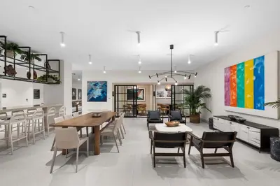 a dining room and living room with a table and chairs at Central Downtown Miami at District 225 Luxury Residence in Miami