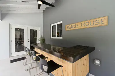 a bar with chairs and a break house sign on a wall at Heated Pool Games Family Haven Near FIU