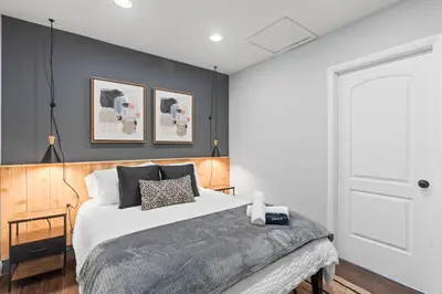 a bedroom with a large bed with black walls at Heated Pool Games Family Haven Near FIU