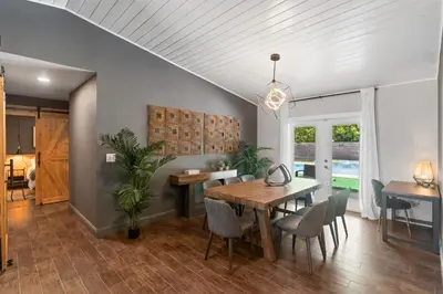a dining room with a table and chairs at Heated Pool Games Family Haven Near FIU