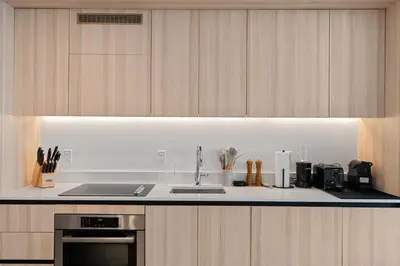 a kitchen with a sink and a stove top oven at Upscale Residence at District 225 - Downtown Miami in Miami
