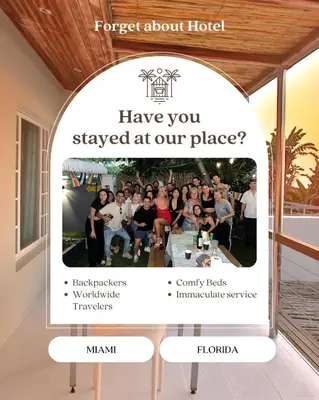 a website for a hotel with a picture of a group of people at Kayoma Hostel in Miami