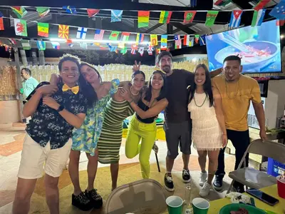 a group of people posing for a picture in a room at Kayoma Hostel in Miami