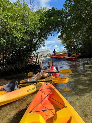 a man is sitting in a kayak in the water at Kayoma Hostel in Miami