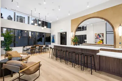 a bar in a restaurant with chairs and tables at Hotel-Style Condo at District 225 in Downtown Miami in Miami