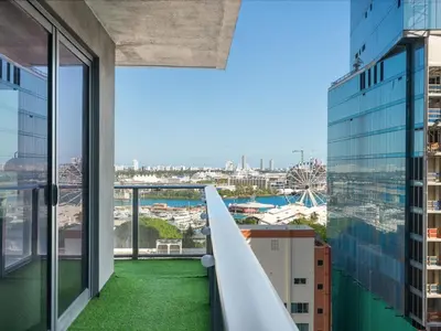 a view from the balcony of a building with green grass at Modern Studio by Bayside & Cruise Port in Miami