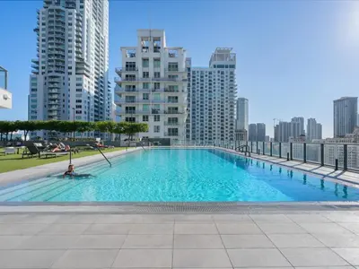 a large swimming pool in a city with tall buildings at Modern Studio by Bayside & Cruise Port in Miami