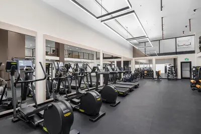 a gym with a lot of treadmills and machines at Luxury Condo at District 225 - Downtown Miami Prime Location in Miami