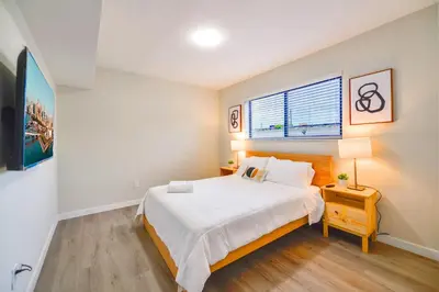 a bedroom with a large bed and a window at Modern Apartment in Prime Miami Location in Miami