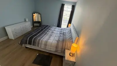 an overhead view of a bedroom with a bed and a window at Canal-front two-bedroom condo near Sunny Isles in North Miami Beach