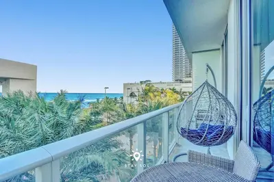 a balcony with a hammock and a view of the ocean at Cozy Apartment -Balcony & Beachfront Resort in Hollywood