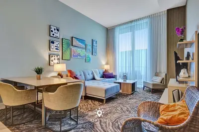 a living room with a couch and a table at Cozy Apartment -Balcony & Beachfront Resort in Hollywood
