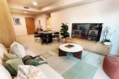 a living room with a couch and a table at Stylish Condo at The Crosby in Miami