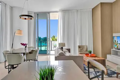 a living room with a couch and a table and chairs at Beautiful Balcony 2BR Resort in Hollywood