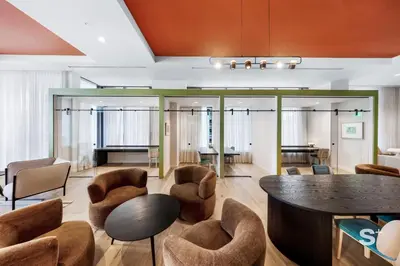 a lobby with chairs and a table and a bar at Modern and Cozy 1BD Apt with Gym & Pool in Miami