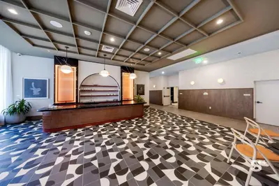 a large lobby with a reception desk and chairs at Modern and Cozy 1BD Apt with Gym & Pool in Miami