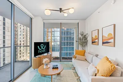 a living room with a couch and a table at Elegant Condo at Crosby Miami Worldcenter W Rooftop Pool & Fitness Center in Miami