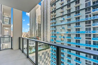 a balcony with a view of a tall building at Elegant Condo at Crosby Miami Worldcenter W Rooftop Pool & Fitness Center in Miami