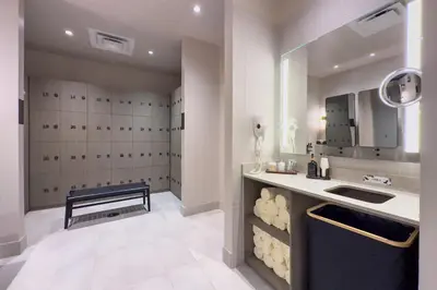 a bathroom with a sink and a bench in a room at 4906 Cityline Penthouse Studio with Balcony a Pool and Gym in Miami Downtown in Miami