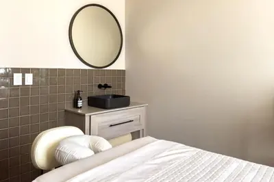 a bedroom with a bed and a mirror on the wall at 4905 Corner Penthouse with Sunset Views a Pool and Gym in Downtown Miami in Miami
