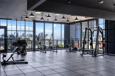 a gym with treadmills and machines in a building at 4905 Corner Penthouse with Sunset Views a Pool and Gym in Downtown Miami in Miami