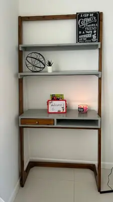 a shelf with a board and a box on it at Florida Cozy Home!!! in Hallandale Beach