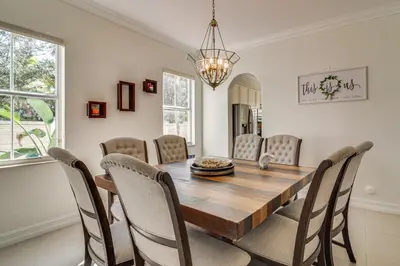 a dining room with a wooden table and chairs at Great for Gatherings! Sleek and Relaxing Hialeah Gem in Hialeah