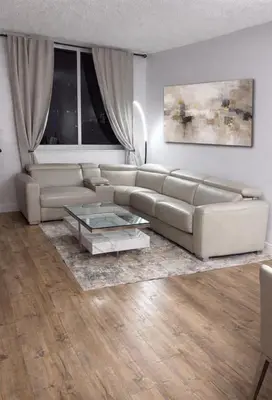 a living room with a couch and a coffee table at Beautiful Apartment in Sunny Isles Beach in Sunny Isles Beach