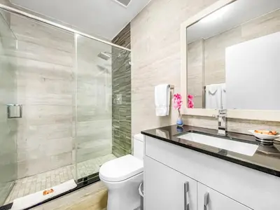 a bathroom with a toilet and a sink and a mirror at Casa Pellegrino Boutique Hotel in Hollywood