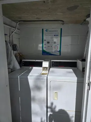 a kitchen with a washer and dryer in a room at West Ave in Miami Beach
