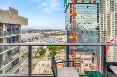 a balcony with a view of a river and buildings at Bay Views Studio in Miami