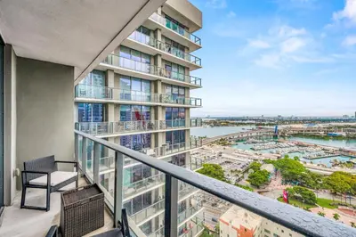 an apartment balcony with a view of a city at Sublime Views Studio in Miami