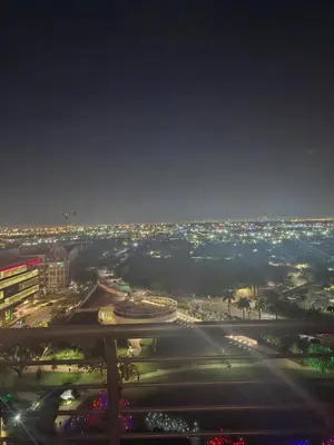 a view of a city at night with lights at Amazing view day & night doral in Miami
