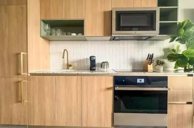 a kitchen with a sink and a microwave and a stove at 4612 High-Floor Studio w Skyline View and a 24-hour Gym in Downtown Miami in Miami