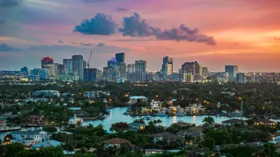 a city skyline with a river and a city at Lauderdale Breeze Villas - Luxury 3 BR Coastal Retreat in Fort Lauderdale