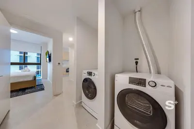 a washing machine and a dryer in a room at Luxurious & Stylish 2BD Apt in Miami Gym & Pool in Miami